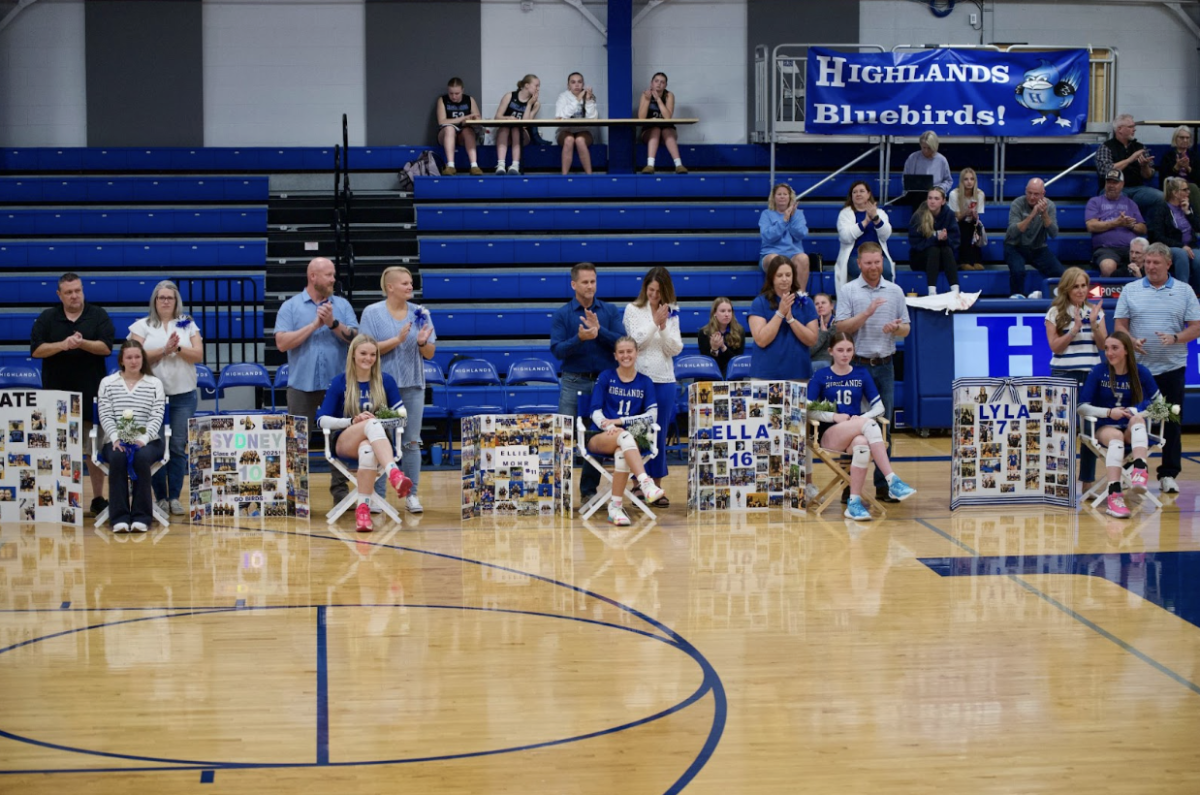 Volleyball seniors, Kate Venneman, Sydney Schomaker, Ellie Mohr, Ella Cox, and Lyla Bottom (12) with their parents on senior night. 
